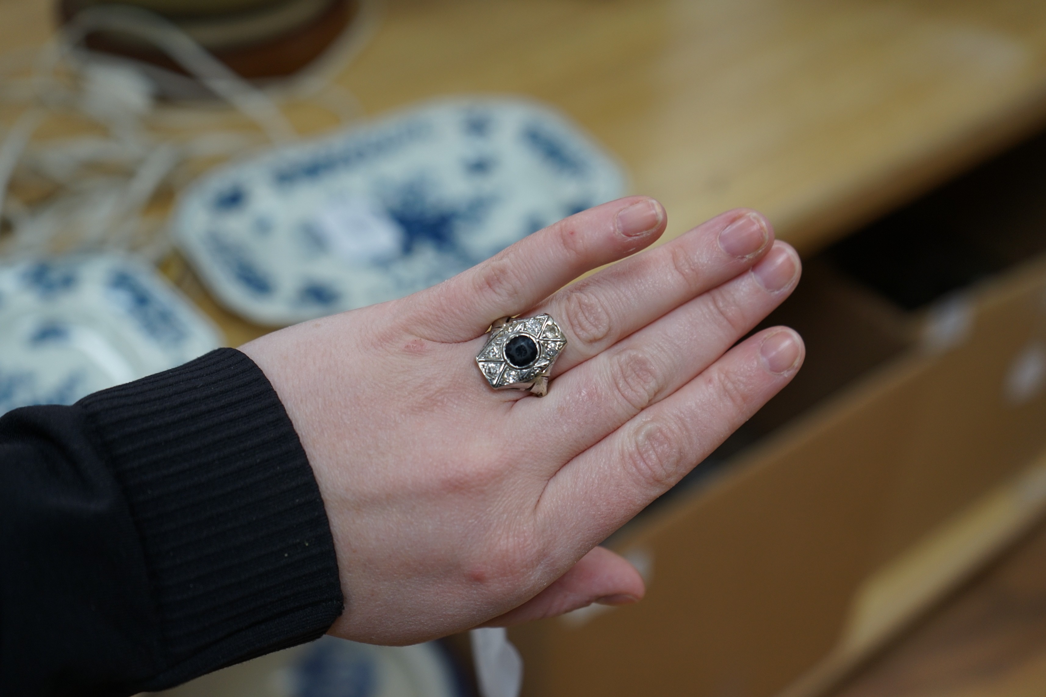 A 1940's? white metal, sapphire and diamond cluster set hexagonal dress ring, size L, gross weight 4.6 grams.